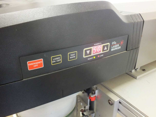 Synrad Fenix Flyer CO2 Laser Marker front panel showing EMERGENCY OFF, LASER ON/OFF, TEST MARK buttons, POWER % display reading 50, and READY/LASE status indicators