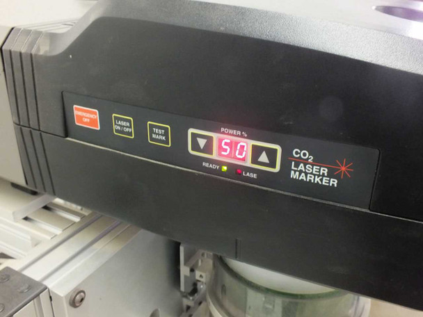 Synrad Fenix Flyer CO2 Laser Marker control panel close-up showing Power % display at 50, CO2 Laser Marker label, and READY and LASE indicator lights