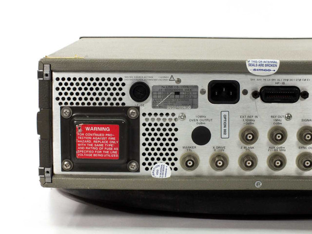 HP 3325A rear panel close-up showing Option 002 label, 10MHz oven output, EXT KEY IN, REF OUT, MARKER, DRIVE, BLANK, AUX, and SYNC OUT BNC connectors