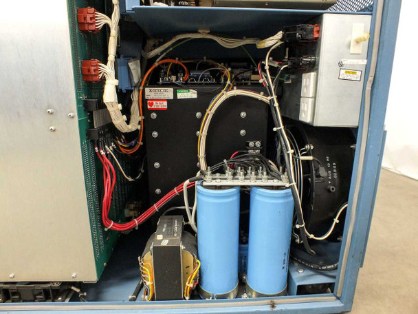 Hughes WD-8702-001 interior power section – Xentek power supply unit, large blue electrolytic capacitors, transformer, and high-voltage wiring bundle