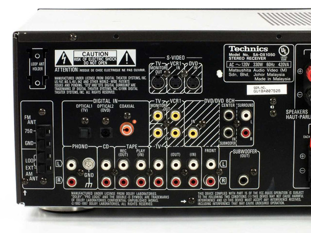 Technics SA-DX1050 rear panel closeup – labeled inputs including Digital In Optical 1/2, Coaxial, S-Video, TV/VCR monitor, DVD 6CH, Phono, CD, Tape, subwoofer out, and front/surround/center speaker terminals