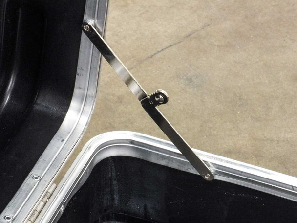 Close-up of interior metal lid support stay bracket on hard travel case