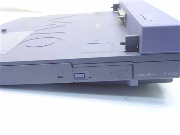 Sony PCGA-DB7 docking station — left side view showing laptop release/lock slider mechanism and media bay slot