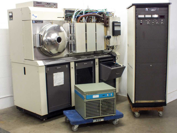 MRC 603-III sputtering system full front view showing main chamber, load-lock, control cabinet, and CTI cryopump compressor on dolly