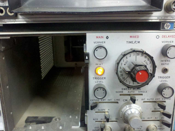 HP 1821A front panel powered on showing orange RESET indicator light glowing — only indicator illuminated during power-on