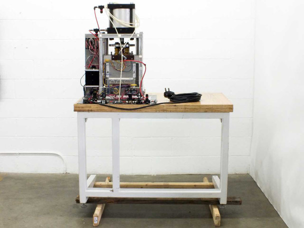 Rear left view of press showing exposed control panel with relay board, solenoid valves, and multi-color wiring harness