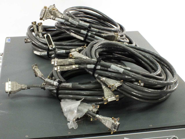 Xicom XTC-140D shown with all four included cable sets — multiple multi-pin D-sub cables with locking hardware laid out on top of the unit