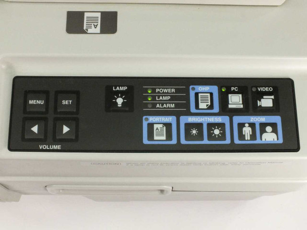 Avio MP-300E — top control panel showing Menu, Set, Volume, Portrait, Brightness, Zoom buttons and Power/Lamp/Alarm indicators with OHP, PC, Video source selectors