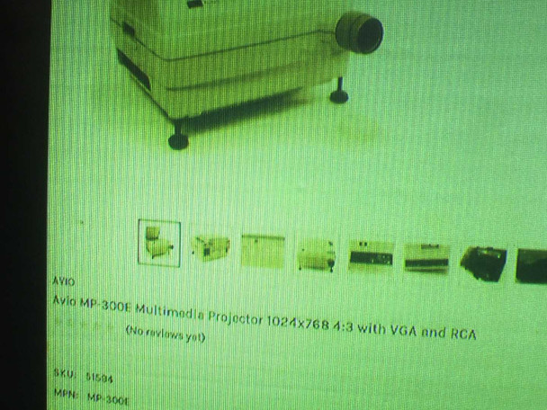 Avio MP-300E — projected image of product listing page showing SKU 51594 and MPN MP-300E during VGA-IN test