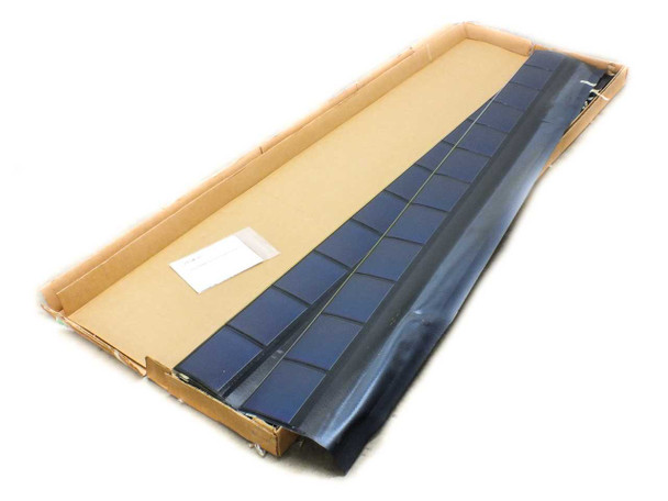 Uni-Solar SHR-17 solar roofing shingle partially unrolled inside open cardboard carton, blue amorphous PV cells visible along the length