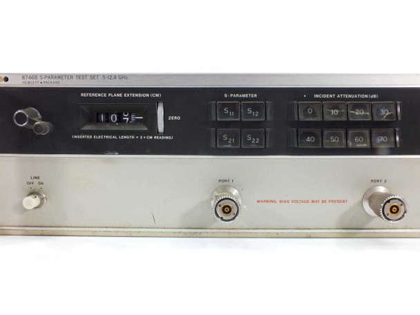 HP 8746B S-Parameter Test Set front panel close-up showing Reference Plane Extension dial, S-Parameter selector buttons (S11, S12, S21, S22), Incident Attenuation switches (0–70 dB), Port 1 and Port 2 Type-N connectors, and bias voltage warning label