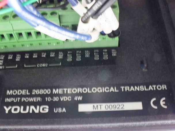 Young 26800 Meteorological Translator label closeup showing MODEL 26800 METEOROLOGICAL TRANSLATOR, INPUT POWER 10-30 VDC 4W, YOUNG USA, CE mark, and terminal block with COM1 COM2 OUT1-OUT4 labels