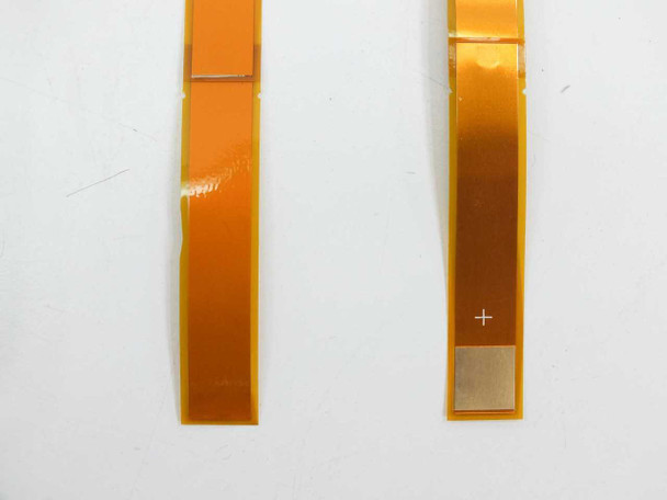 Side-by-side comparison of two individual 201878-001 Schottky bypass diode ribbons showing contact pad detail and polarity marking