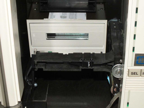 Interior view of EXB-10 enclosure showing tape drive module seated in autoloader chassis with belt mechanism