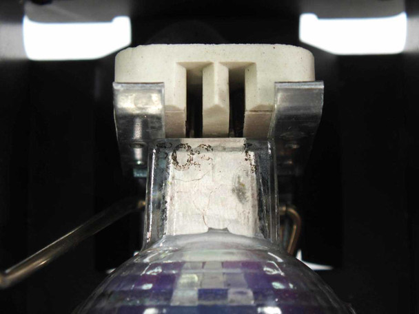 Cool-Lux Mini-Cool spotlight — close-up of bulb base and ceramic bi-pin socket holder inside the fixture