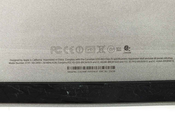 Apple iMac A1311 regulatory label showing Model A1311, power rating 100-240V 50-60Hz 4.0A, EMC 2428, serial number C02HM1NHDHIF
