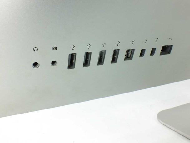 Apple iMac 27-inch MB952LL/A — rear port panel showing headphone jack, audio in, three USB 2.0 ports, FireWire 800, Mini DisplayPort ports, and Ethernet