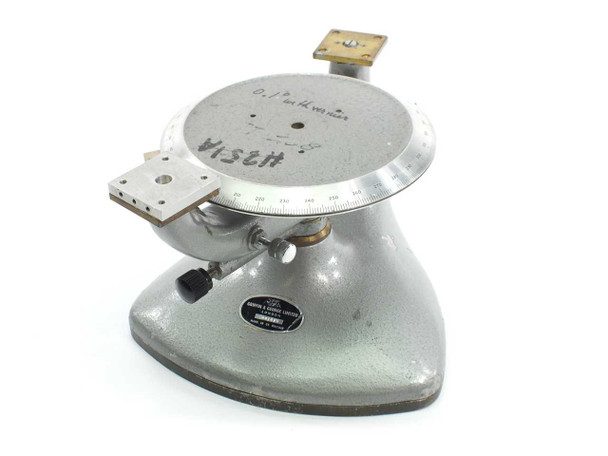 Griffin & George Ltd 6-inch rotary precision manual measuring stage — front three-quarter view showing divided circle table, vernier scale, cast base, and small bracket attachments