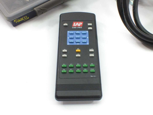 LAP CAD-PRO IR remote control — black handheld remote with blue button matrix, green F1–F10 function keys, Rev 2.5