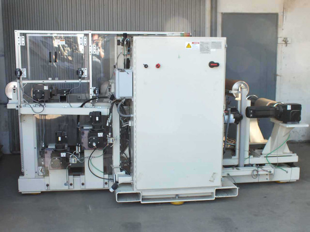 Preco coil slitter full machine overview – left side showing slitter section, control cabinet, and rewind arm