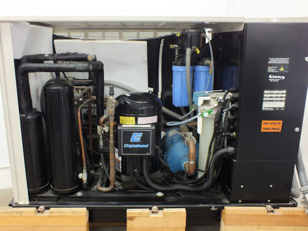 Affinity CWA-100K-MP21CB chiller – interior view showing Copeland compressor, refrigerant vessels, blue water filter canisters, and plumbing