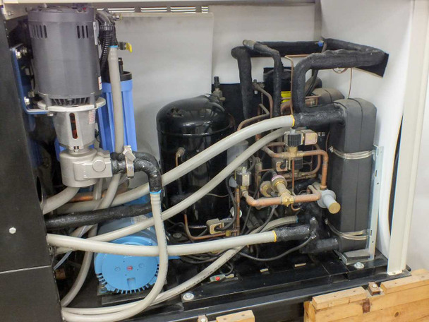 Affinity CWA-100K-MP21CB chiller – left-side interior showing blue circulation pump, motor, blue filter canister, and dual compressors with refrigerant plumbing