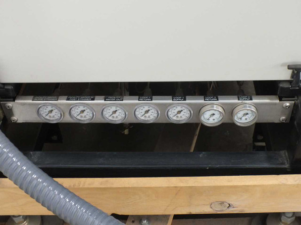 Affinity CWA-100K-MP21CB chiller – bottom pressure gauge panel showing seven gauges labeled for facility and loop supply/return and water outlet
