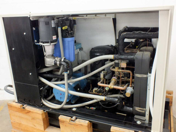 Affinity CWA-100K-MP21CB chiller – left-side interior alternate angle showing pump assembly, blue filter housing, compressors, and copper refrigerant lines