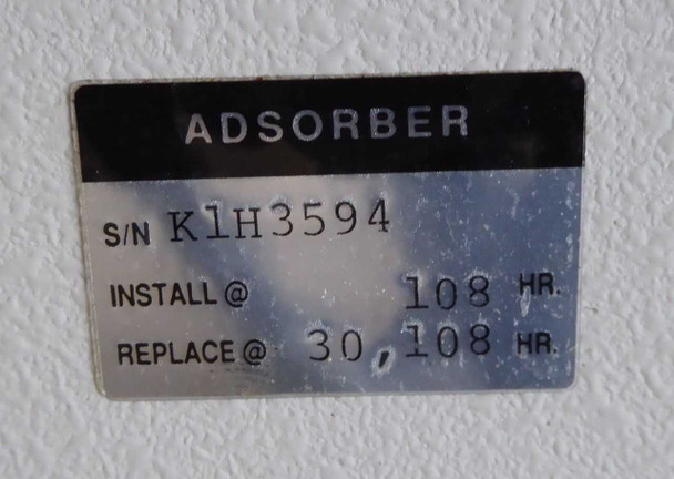 Adsorber label on Ebara CryoCompressor showing serial number K1H3594, install at 108 HR, replace at 30108 HR