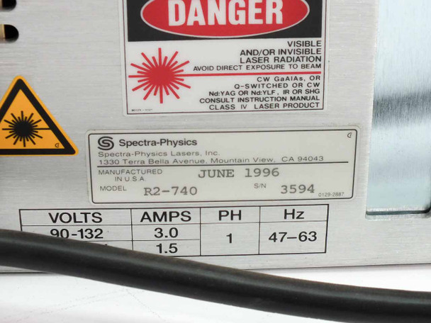 Spectra-Physics R2-740 rating plate showing model R2-740, manufactured June 1996, 90-132V, 3.0A / 1.5A, 1PH, 47-63Hz, with laser danger warning label