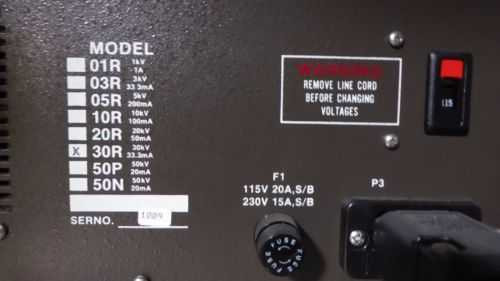 ElectronCure 30X model selection plate – rear label showing model variants (01R through 30N), with 30R (30kV, 33.3mA) checked; fuse ratings F1: 115V 20A or 230V 15A visible