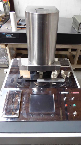 ElectronCure 30X top work surface – stainless steel deck with wafer chuck stage, control switches, indicator lights, and accessory holders visible