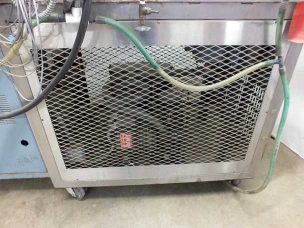 Blue M FR-256PB-1 rear compressor section — mesh-guarded single-stage refrigeration compressor with green coolant hoses visible