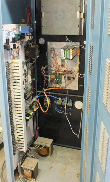 Blue M FR-256PB-1 control cabinet interior — terminal strip wiring, relay boards, circuit boards, transformers at base, and wiring harness visible with panel door open