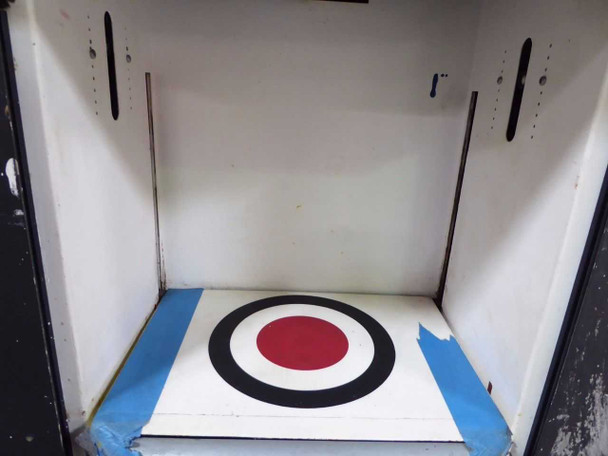 Interior dispensing bay of Corob AC10000 showing white-painted chamber with vertical guide rails and colorant target calibration bullseye plate taped to floor