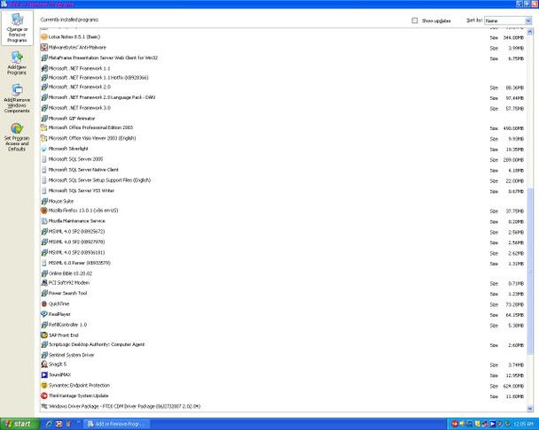Windows Add or Remove Programs list continued showing Microsoft Office 2003, SQL Server 2005, .NET Framework versions, DYMO label software, Innova drivers, and other supporting applications installed on Dell PC