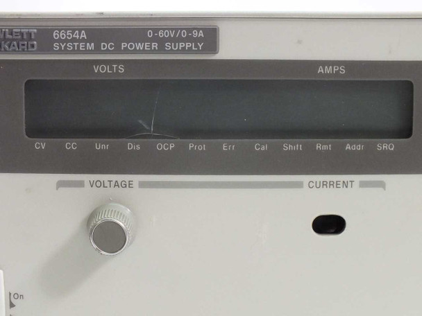 HP 6654A front panel close-up showing cracked VOLTS/AMPS display and VOLTAGE knob; CURRENT knob area visible