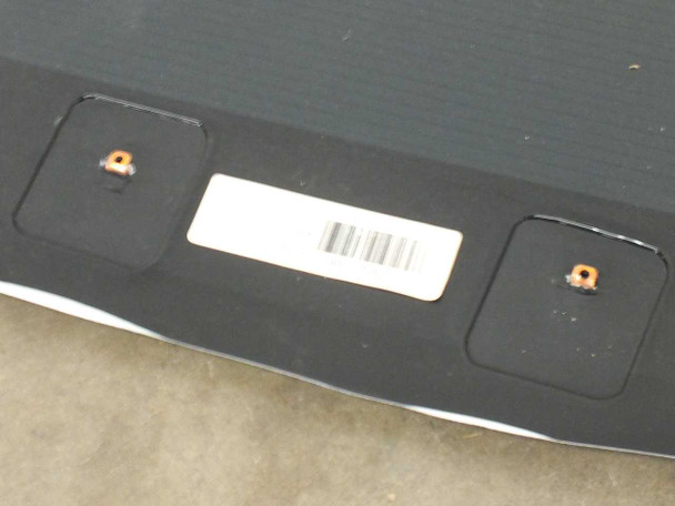 Close-up of Xunlight XUS19-134 solar panel corner showing two MC4 connector ports and white barcode label on dark backing