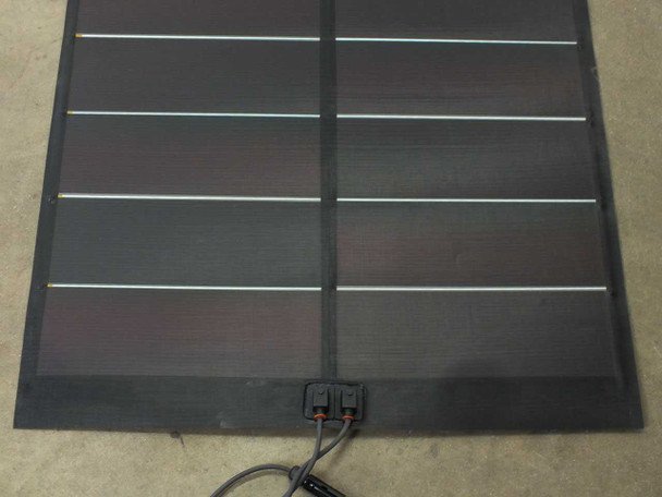 Xunlight XSD38-123 flexible solar panel close-up of bottom end showing Helios M4 connector junction box with positive and negative leads