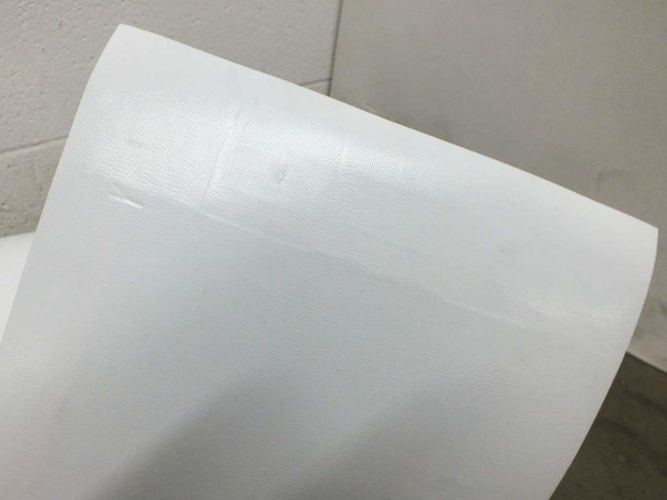Close-up of Xunlight XNS10-55 white backing surface showing minor surface scuffs and light creasing