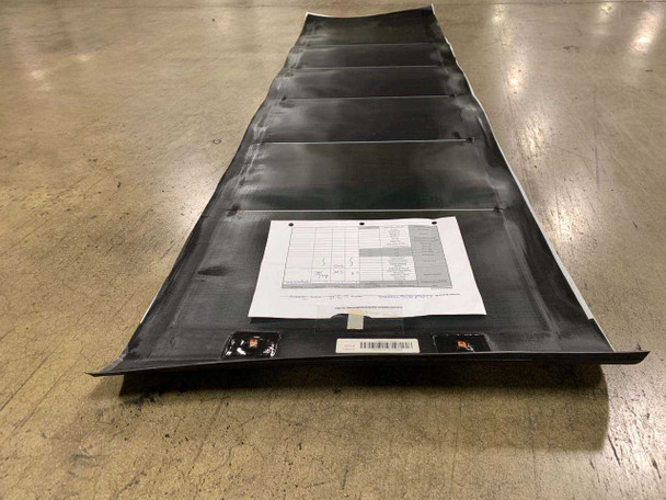 Xunlight XRS6-50 flexible solar panel reverse side showing spec label sheet and two MC4 connector leads at bottom edge