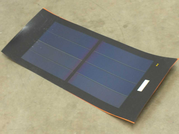 iLand XZS8-16 16W 12V flexible amorphous solar panel lying flat, showing 8-cell dark blue panel surface with two yellow solder-point markers and label on right edge