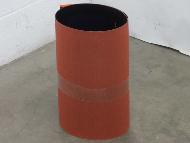 iLand XZS8-16 flexible amorphous solar panel rolled into a cylinder showing orange corrugated backing, secured with tape band, approximately 8-inch diameter roll