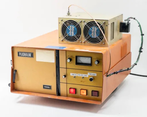 Tegal PlasmaLine 200 Plasma Barrel Etcher front-right three-quarter view with Comdel CPS-200AX RF power supply mounted on top, dual cooling fans visible
