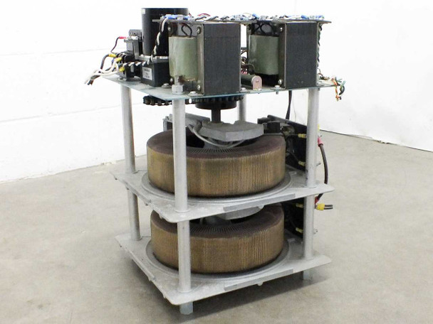 Staco 30M6020-2P motorized variac — front-right angled view showing dual toroidal autotransformer cores, top-shelf motor and control transformers on grey open-frame rack assembly