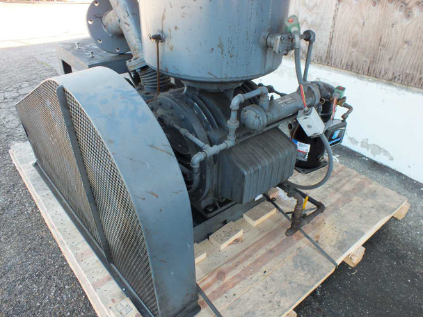 Beach Russ 615-325 vacuum pump — rear three-quarter view showing belt guard, oil separator tank, motor/capacitor assembly, and pallet base