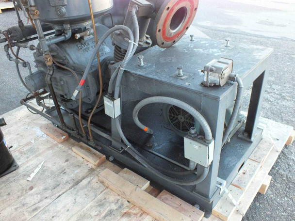 Beach Russ 615-325 vacuum pump — close front view of motor enclosure box, cooling fan, flex hoses, and pump body mounted on pallet