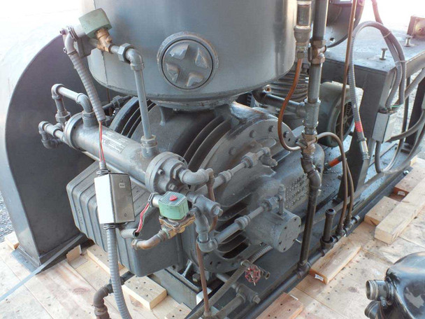 Beach Russ 615-325 vacuum pump — close-up of pump body showing multi-cylinder compressor head, solenoid valve, copper tubing, and piping detail