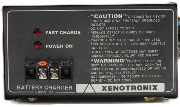 Xenotronix 1LC162A-29 battery charger – close-up of front panel showing Fast Charge and Power On indicators, battery clamp terminals, and Xenotronix branding