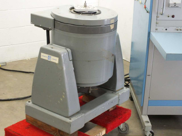 Unholtz-Dickie T110 Electrodynamic Shaker – front and side view showing circular armature table, gray cast housing, and Unholtz-Dickie nameplate